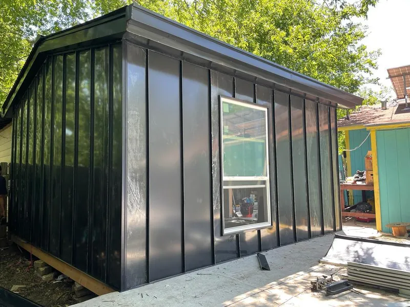 Black standing seam metal wall panels for Roof Inspection in Okeechobee